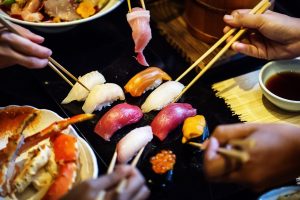 people sharing japanese food