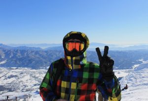 skier gives peace sign